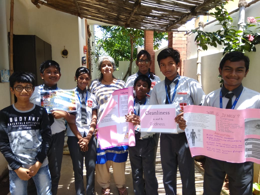 community1 Kids displaying sign boards during a community service
